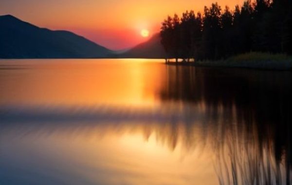 A tranquil lake at golden sunset — poetry